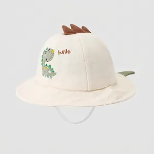Detail of baby sun hat with cute dinosaur embroidery and 3D decorative back fins