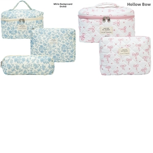 Quilted floral cosmetic bags in blue orchid and pink bow patterns set for travel