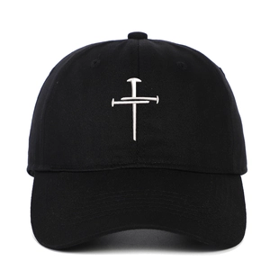 Classic black cotton baseball cap featuring white cross embroidery on a six-panel crown