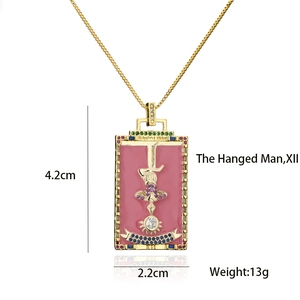 Detailed view of The Hanged Man tarot pendant with pink enamel and colorful zircons