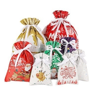 Festive Christmas Santa drawstring gift bags for candy packaging in various sizes