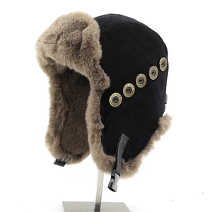 Winter thermal trapper hat with brown faux fur lining and decorative metal buttons