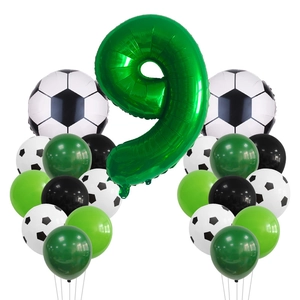 Close-up of a large green number 9 foil balloon with soccer party latex decorations