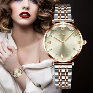 Close-up of rose gold women's watch with champagne dial and crystal markers