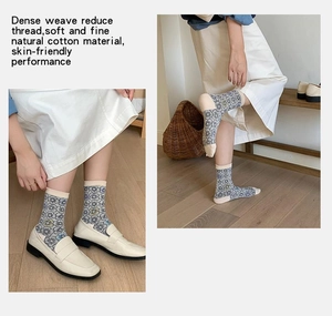 Detail of vintage floral crew socks made from soft, dense weave natural cotton material