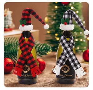 Close-up of red and white plaid Christmas wine bottle hat and scarf decor set