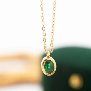 Minimalist gold stainless steel necklace with oval emerald zircon pendant in velvet box