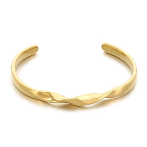 Polished 18K gold plated stainless steel bangle with wavy geometric line design