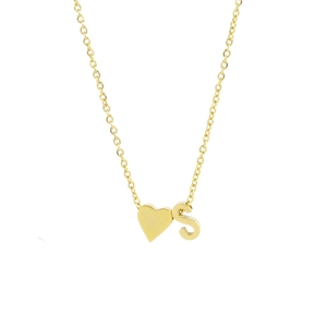 Macro shot of gold heart pendant and uppercase letter S charm on stainless steel necklace