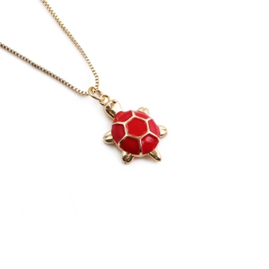 Gold plated tortoise pendant necklace with vibrant red enamel shell on box chain