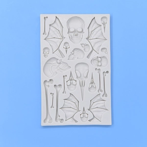 Grey silicone mold with skulls wings and bones for DIY cake fondant and baking crafts
