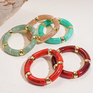 Chic acrylic bangle set with marbled textures and gold beads in five assorted colors