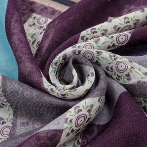 Macro view of cotton linen scarf with mandala print and detailed fabric texture