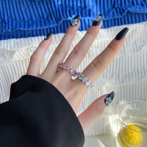 Detail of S925 silver ring featuring gradient pink and white zircon stones set in full band