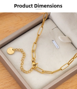 Detail of gold stainless steel oval link chain with lobster clasp and S.STEEL tag