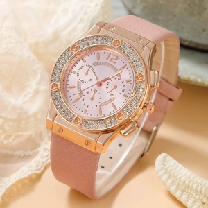 Close-up of pink rubber strap and rose gold bezel with sparkling rhinestones and screws