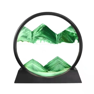 Detail of green liquid sand art with black round frame and mountain silhouette effect