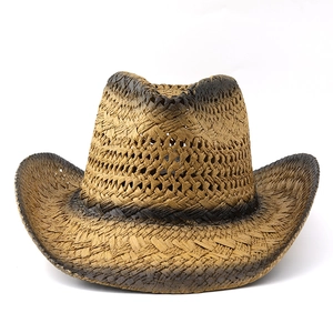 Detail of hand-woven straw cowboy hat featuring burnt gradient edges and breathable texture