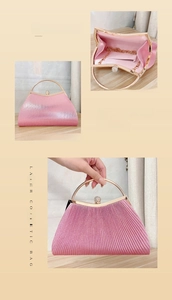 Detail of pink laser pleated evening bag with golden metal handle and rhinestone lock