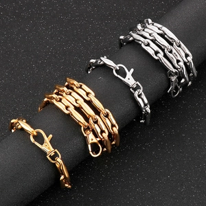 Detail of gold and silver geometric coffee bean link chains with secure lobster clasps