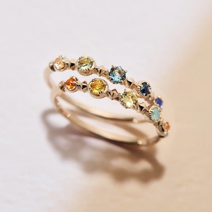 Detailed macro view of 925 silver 14K gold ring featuring five colorful gemstones