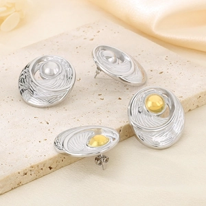 Minimalist oval stainless steel stud earrings with sunburst texture in gold and silver