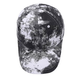 Detail of classic six-panel tie-dye baseball cap featuring black and white marble pattern