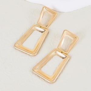 Polished gold geometric trapezoid earrings with a nested rectangular metal design