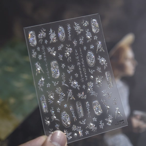 Detailed macro view of laser holographic butterfly and flower stickers on transparent film