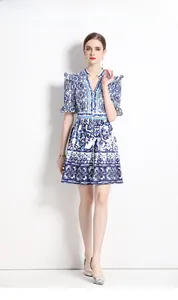 Close-up of blue and white Majolica print on V-neck dress with ruffle sleeve details