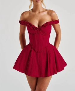 Detail of red off-shoulder mini dress with lace embroidery and waist tie design