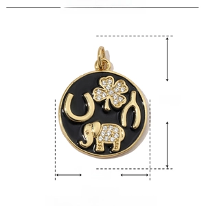 Macro detail of round gold pendant with black enamel elephant and clover lucky motifs