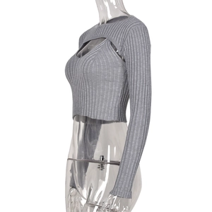 Detail view of grey ribbed knit long sleeve cropped top with 45-degree side profile view
