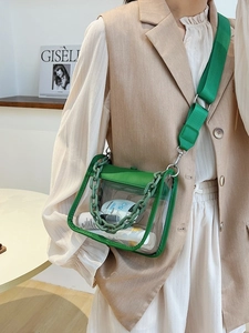 Transparent PVC crossbody mini bag in neon green with chunky chain and wide strap