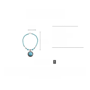 Detailed view of turquoise stone beads and round pendant with alloy border design