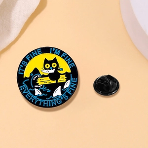 Macro detail of cat in danger enamel pin with IT'S FINE I'M FINE text and rubber back