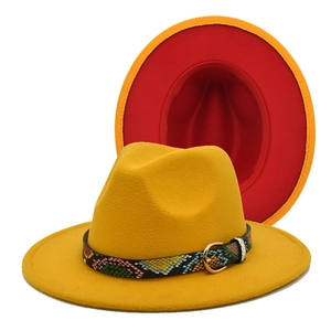 Detail of yellow fedora with red contrast lining and snakeskin buckle band