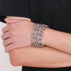 Macro shot of silver woven mesh bracelet with wide twisted stainless steel links