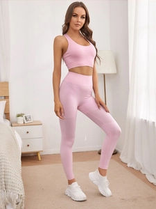 Detailed ribbed texture and breathable mesh on light pink yoga leggings and top