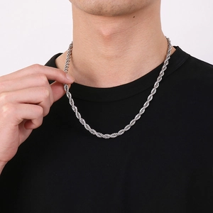 Classic silver 4mm stainless steel rope chain necklace on a model wearing a black t-shirt