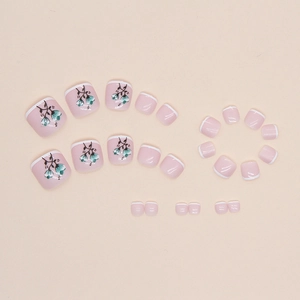 Minimalist French style pink press-on toe nails with white tips and teal floral patterns