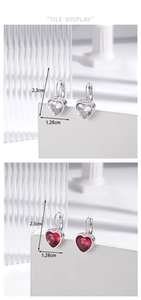 Detailed view of silver heart earrings with red and white zircon stones and size markers