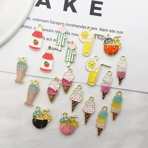 Flat lay of colorful summer drink and ice cream alloy charms for DIY jewelry making