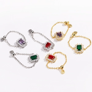 Adjustable chain ring with rectangular colorful gemstone and small heart pendant detail