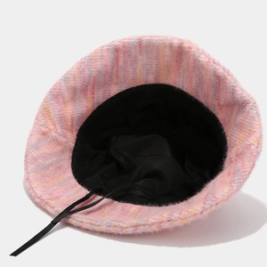 Pink and orange textured knit bucket hat with black lining and adjustable drawstring