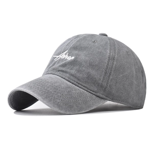 Washed dark gray baseball cap with white Asher embroidery and curved brim in 45-degree view