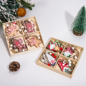 Wooden gingerbread man and gnome Christmas tree ornaments set in a decorative wooden gift box