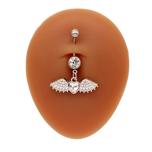 Silver heart wing belly ring with sparkling crystals on a navel piercing model