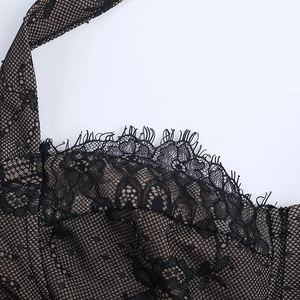 Detailed macro shot of eyelash lace trim and fine mesh texture on women corset top