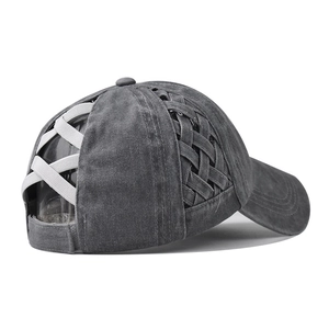 Detail view of washed cotton criss-cross ponytail cap with elastic band for messy buns